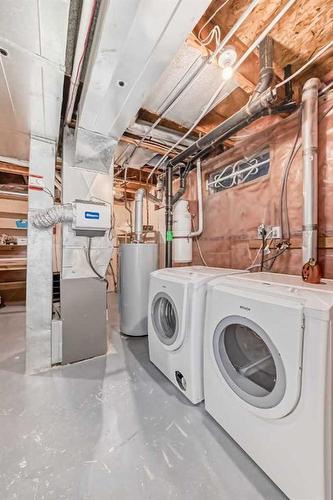 219 Coachway Road Sw, Calgary, AB - Indoor Photo Showing Laundry Room