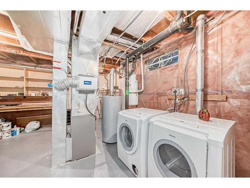 219 Coachway Road Sw, Calgary, AB - Indoor Photo Showing Laundry Room