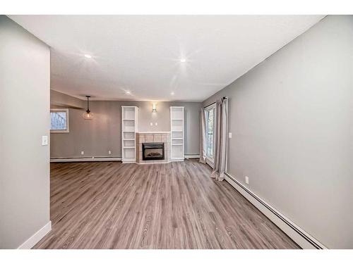 4-1622 28 Avenue Sw, Calgary, AB - Indoor With Fireplace