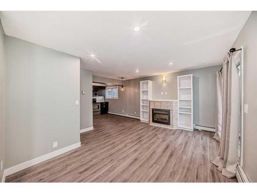 4-1622 28 Avenue Sw, Calgary, AB - Indoor With Fireplace