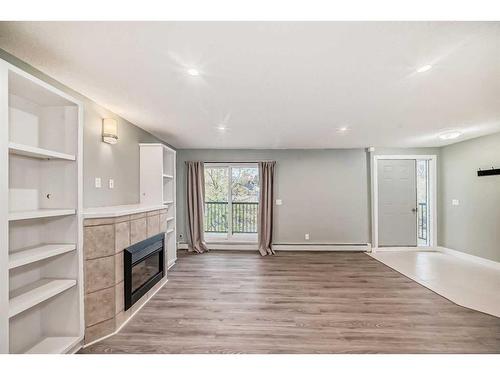 4-1622 28 Avenue Sw, Calgary, AB - Indoor With Fireplace