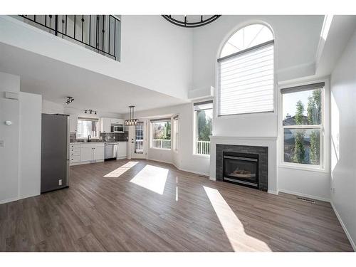 298 Arbour Crest Drive Nw, Calgary, AB - Indoor Photo Showing Living Room With Fireplace