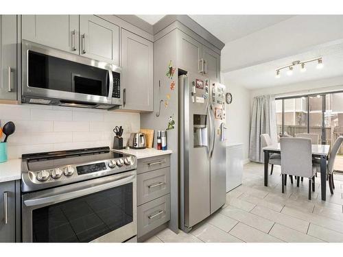 34-3032 Rundleson Road Ne, Calgary, AB - Indoor Photo Showing Kitchen With Stainless Steel Kitchen