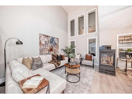 281 Cranberry Close Se, Calgary, AB - Indoor Photo Showing Living Room With Fireplace