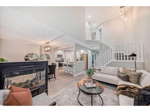 281 Cranberry Close Se, Calgary, AB - Indoor Photo Showing Living Room With Fireplace