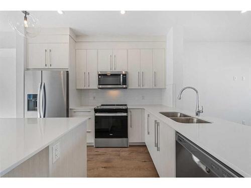 1303-280 Chelsea Road, Chestermere, AB - Indoor Photo Showing Kitchen With Stainless Steel Kitchen With Double Sink With Upgraded Kitchen