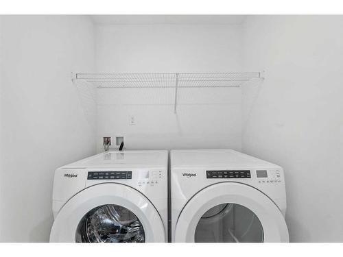 1303-280 Chelsea Road, Chestermere, AB - Indoor Photo Showing Laundry Room