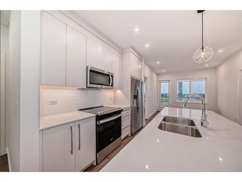 2409-395 Skyview Parkway Ne, Calgary, AB - Indoor Photo Showing Kitchen With Stainless Steel Kitchen With Double Sink With Upgraded Kitchen