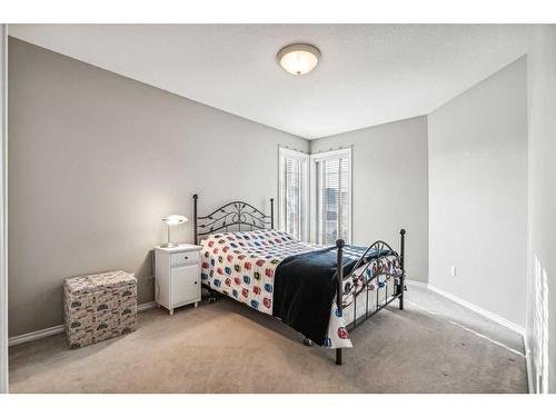 125 Evergreen Place Sw, Calgary, AB - Indoor Photo Showing Bedroom