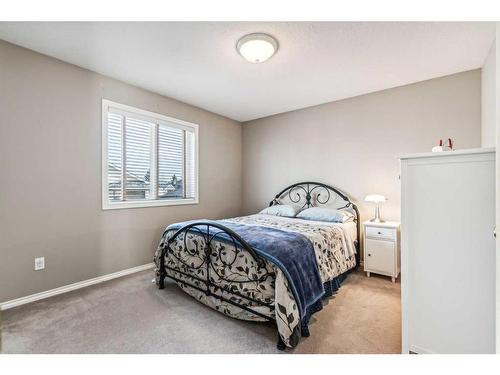 125 Evergreen Place Sw, Calgary, AB - Indoor Photo Showing Bedroom