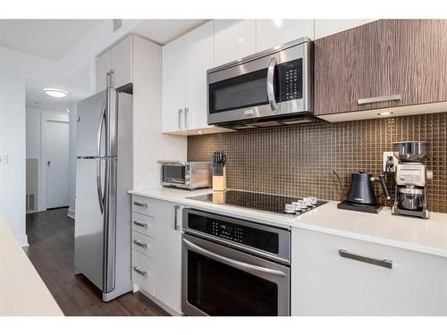 224-619 Confluence Way Se, Calgary, AB - Indoor Photo Showing Kitchen With Stainless Steel Kitchen