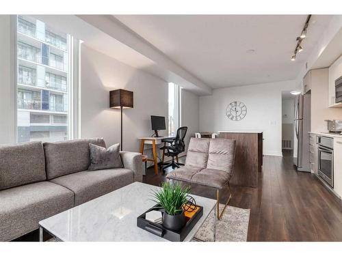 224-619 Confluence Way Se, Calgary, AB - Indoor Photo Showing Living Room