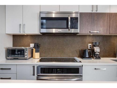 224-619 Confluence Way Se, Calgary, AB - Indoor Photo Showing Kitchen With Upgraded Kitchen