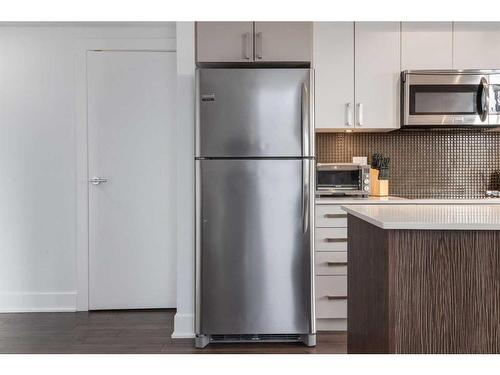 224-619 Confluence Way Se, Calgary, AB - Indoor Photo Showing Kitchen With Stainless Steel Kitchen