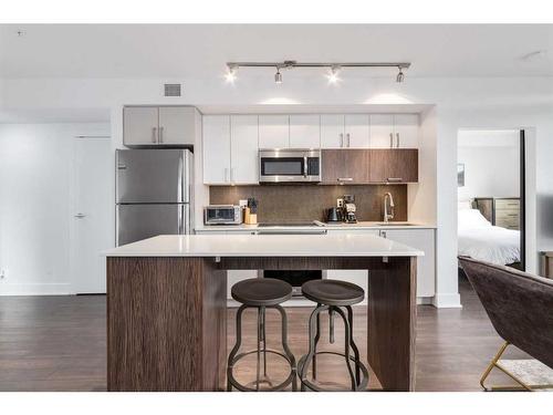 224-619 Confluence Way Se, Calgary, AB - Indoor Photo Showing Kitchen With Stainless Steel Kitchen With Upgraded Kitchen