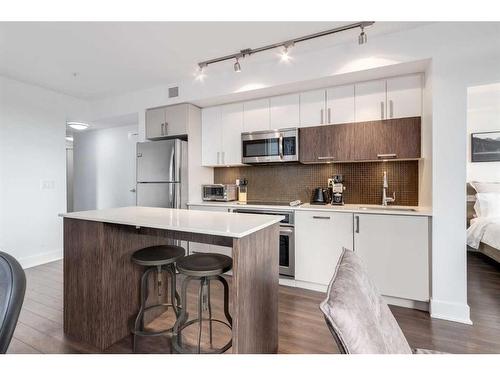 224-619 Confluence Way Se, Calgary, AB - Indoor Photo Showing Kitchen With Stainless Steel Kitchen With Upgraded Kitchen