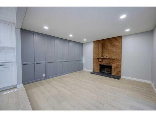 700 Woodpark Boulevard Sw, Calgary, AB - Indoor With Fireplace