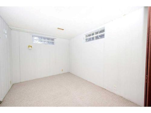 700 Woodpark Boulevard Sw, Calgary, AB - Indoor Photo Showing Other Room