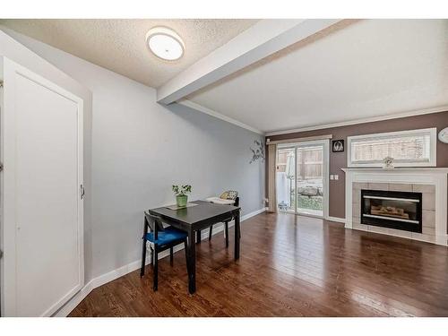 123 Country Hills Villas Nw, Calgary, AB - Indoor Photo Showing Living Room With Fireplace