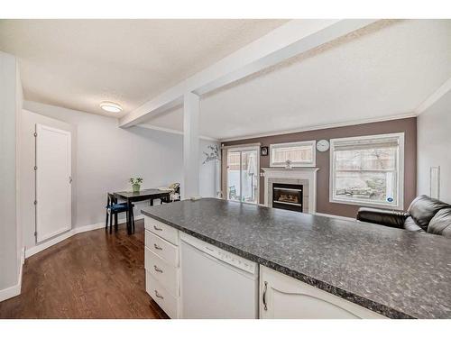 123 Country Hills Villas Nw, Calgary, AB - Indoor Photo Showing Other Room With Fireplace