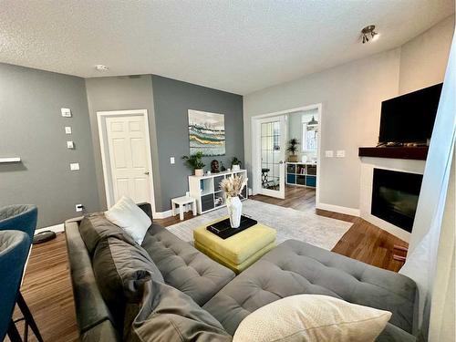 118-126 14 Avenue Sw, Calgary, AB - Indoor Photo Showing Living Room With Fireplace