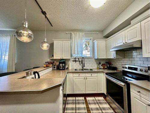 118-126 14 Avenue Sw, Calgary, AB - Indoor Photo Showing Kitchen With Double Sink