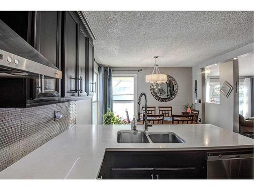 56 Strathclair Place Sw, Calgary, AB - Indoor Photo Showing Kitchen With Double Sink