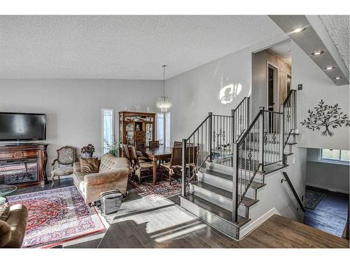 56 Strathclair Place Sw, Calgary, AB - Indoor Photo Showing Living Room With Fireplace