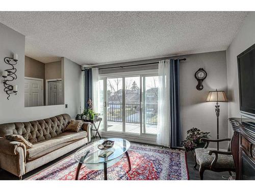 56 Strathclair Place Sw, Calgary, AB - Indoor Photo Showing Living Room