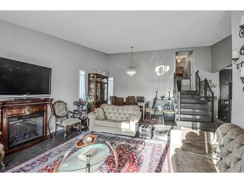 56 Strathclair Place Sw, Calgary, AB - Indoor Photo Showing Living Room With Fireplace