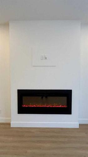 20 Cityline Mount Ne, Calgary, AB - Indoor Photo Showing Other Room With Fireplace