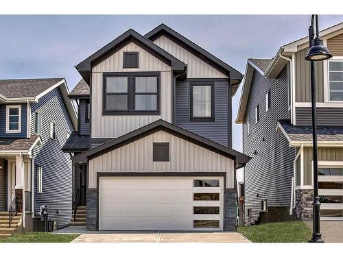 148 Sundown Crescent, Cochrane, AB - Outdoor With Facade