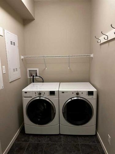 106 Panatella Walk Nw, Calgary, AB - Indoor Photo Showing Laundry Room