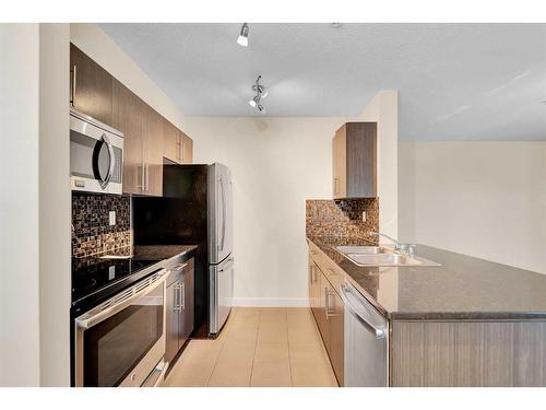 1301-1317 27 Street Se, Calgary, AB - Indoor Photo Showing Kitchen With Stainless Steel Kitchen With Double Sink