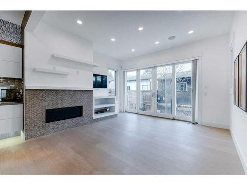 2012 22 Avenue Nw, Calgary, AB - Indoor Photo Showing Living Room With Fireplace