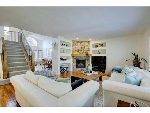 40 Gleneagles View, Cochrane, AB - Indoor Photo Showing Living Room With Fireplace