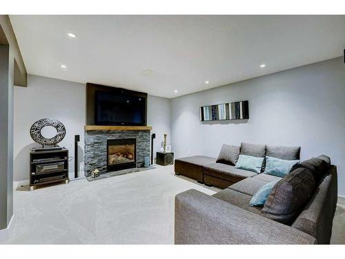 40 Gleneagles View, Cochrane, AB - Indoor Photo Showing Living Room With Fireplace