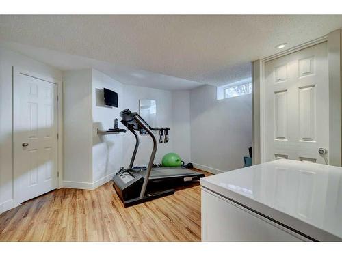 40 Gleneagles View, Cochrane, AB - Indoor Photo Showing Gym Room