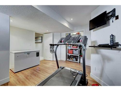 40 Gleneagles View, Cochrane, AB - Indoor Photo Showing Gym Room