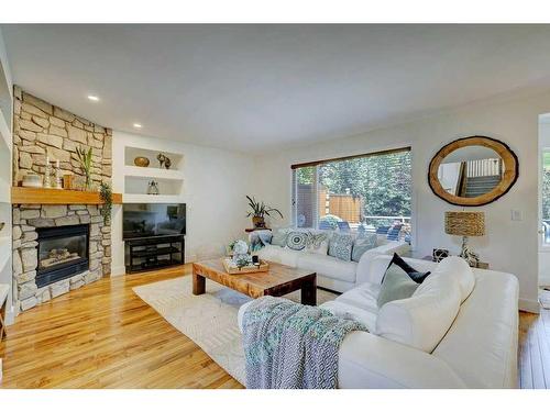 40 Gleneagles View, Cochrane, AB - Indoor Photo Showing Living Room With Fireplace