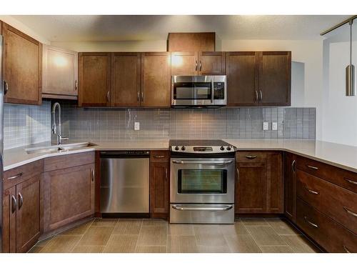 2206-1320 1 Street Se, Calgary, AB - Indoor Photo Showing Kitchen With Stainless Steel Kitchen With Double Sink