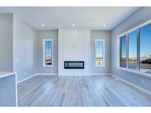 534 Lucas Nw, Calgary, AB - Indoor Photo Showing Living Room With Fireplace