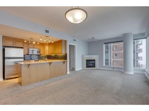 1403-910 5 Avenue Sw, Calgary, AB - Indoor With Fireplace