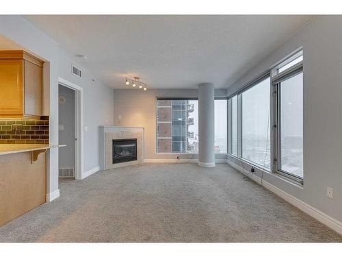 1403-910 5 Avenue Sw, Calgary, AB - Indoor With Fireplace