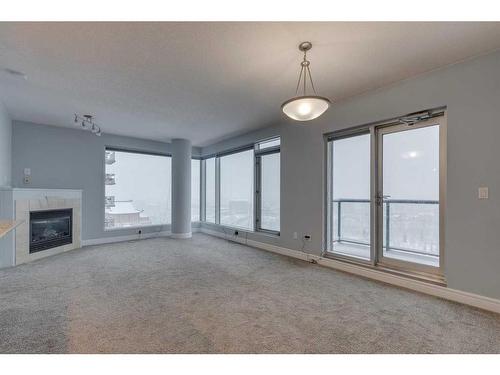 1403-910 5 Avenue Sw, Calgary, AB - Indoor With Fireplace