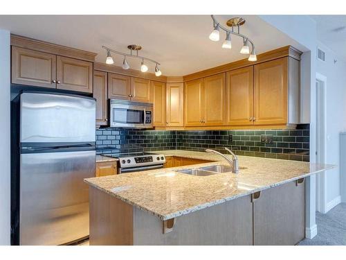 1403-910 5 Avenue Sw, Calgary, AB - Indoor Photo Showing Kitchen With Double Sink