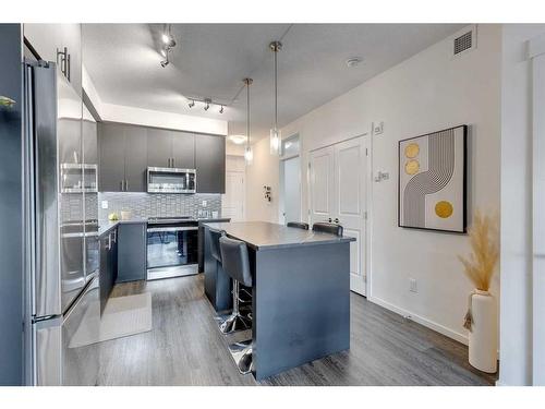 8103-151 Legacy Main Street Se, Calgary, AB - Indoor Photo Showing Kitchen With Stainless Steel Kitchen With Upgraded Kitchen