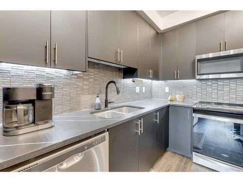 8103-151 Legacy Main Street Se, Calgary, AB - Indoor Photo Showing Kitchen With Stainless Steel Kitchen With Double Sink With Upgraded Kitchen