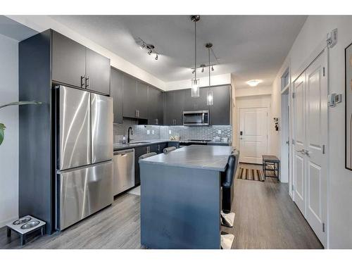 8103-151 Legacy Main Street Se, Calgary, AB - Indoor Photo Showing Kitchen With Stainless Steel Kitchen With Upgraded Kitchen