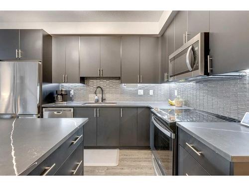 8103-151 Legacy Main Street Se, Calgary, AB - Indoor Photo Showing Kitchen With Stainless Steel Kitchen With Upgraded Kitchen